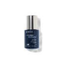 Blue skincare bottle with silver cap on a white background