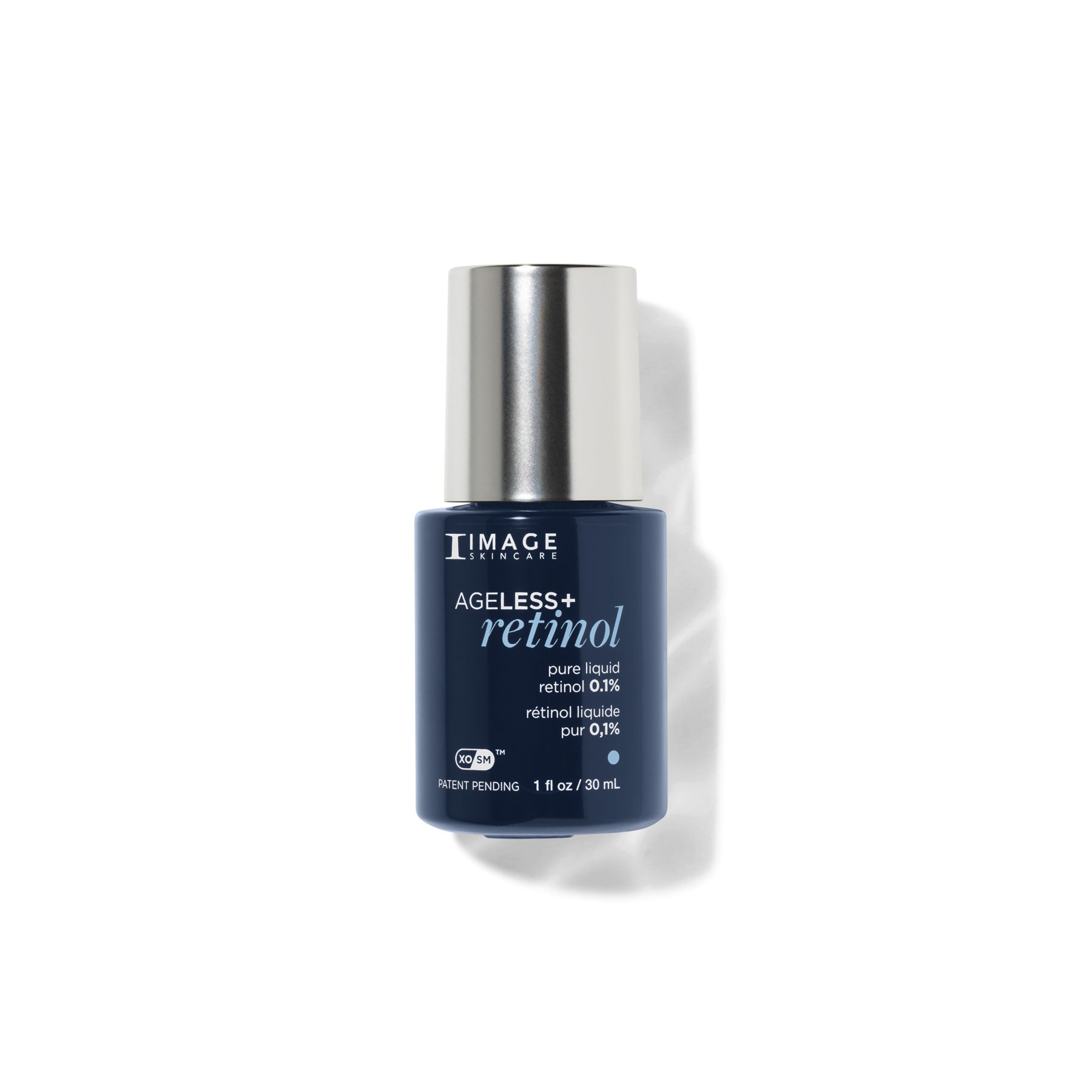 Blue skincare bottle with silver cap on a white background