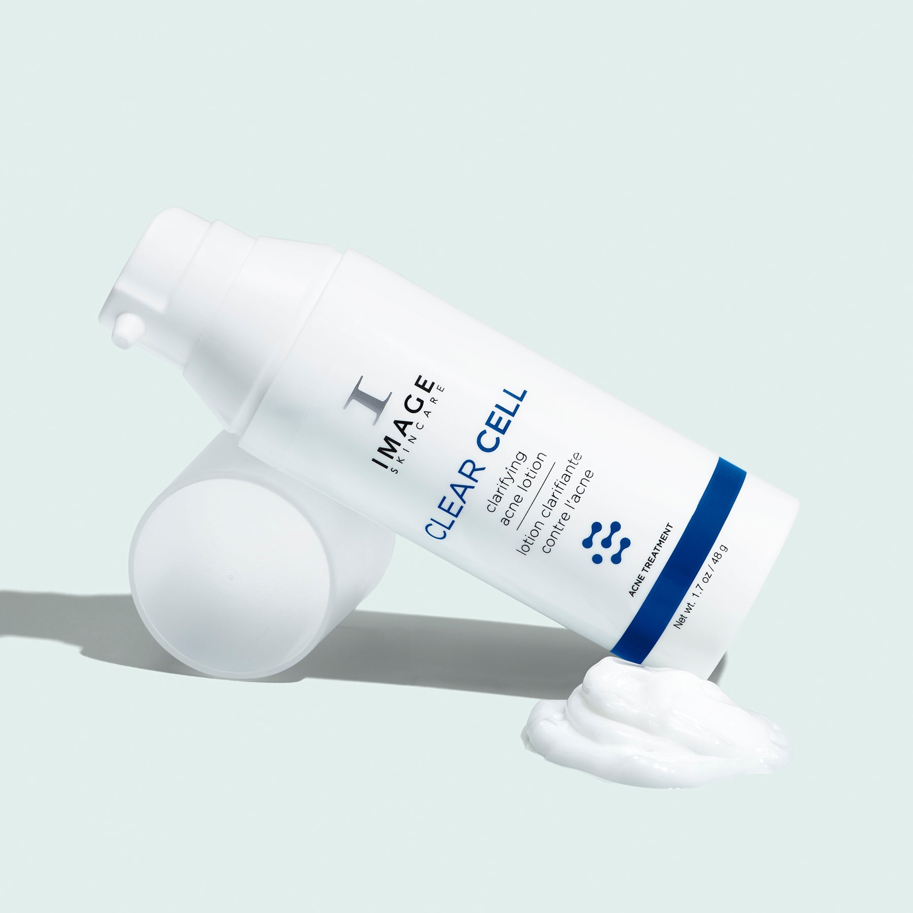 clear cell acne lotion bottle on lotion swatch